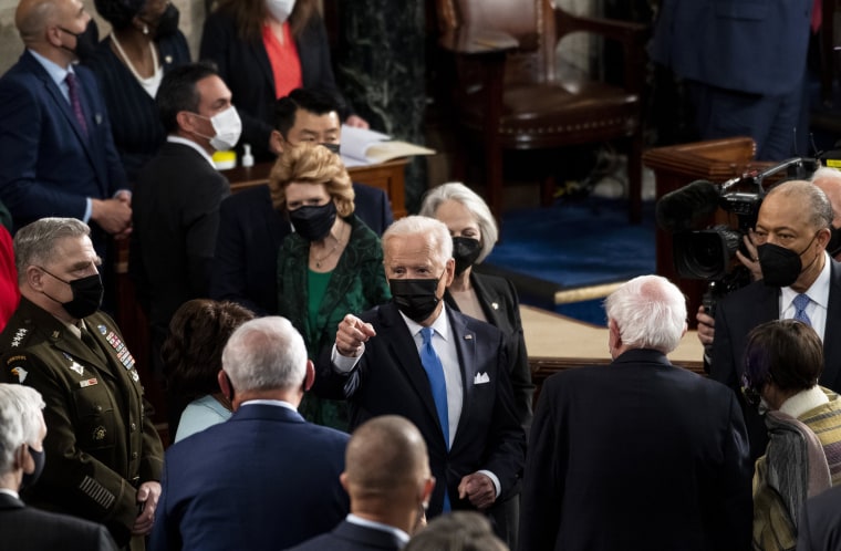 Image: President Joe Biden speaks with lawmakers after his joint address to Congress at the Capitol on April 28, 2021.