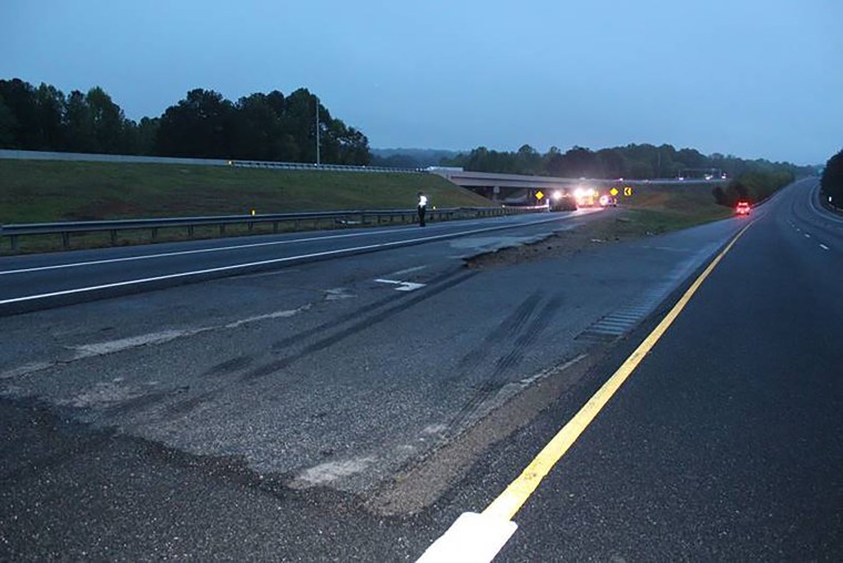 Tire marks could be seen on the pavement near the scene of a deadly crash in Gwinnett County, Georgia, on Saturday, April 24, 2021.