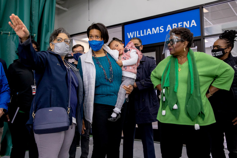 Dr. GiGi El-Bayoumi shows D.C. mayor Muriel Bowser and her daughter Miranda Bowser, alongside Cora Masters Barry, the Southeast Tennis and Learning Center
