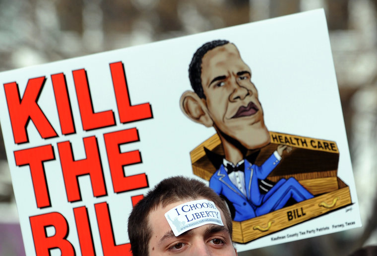 Image: Protesters gather at a demonstration against President Barack Obama's healthcare reform bill organized by the American Grass Roots Coalition and the Tea Party Express in Washington on March 16, 2010.