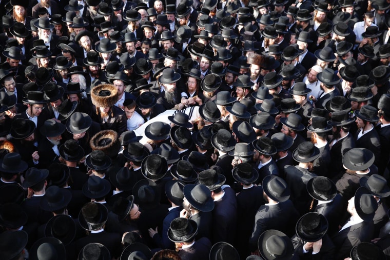 Mourners carry the body of a person who died during Lag BaOmer celebrations at Mt. Meron, at his funeral in Jerusalem on Friday.