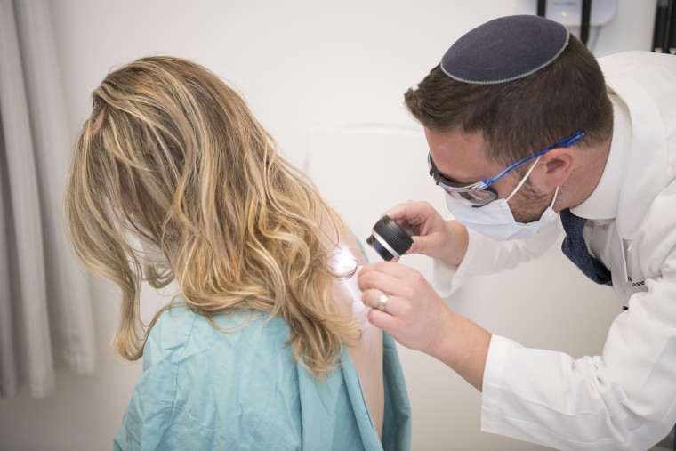 Jones get a skin check from Dr. Joshua Arbesman, a dermatologist at the Cleveland Clinic.