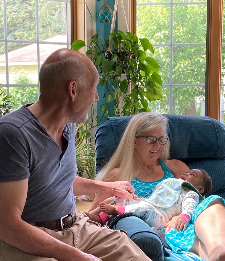 Cori Salchert and her husband, Mark, are pictured with Kassidy, who will turn 2 in July 2021.