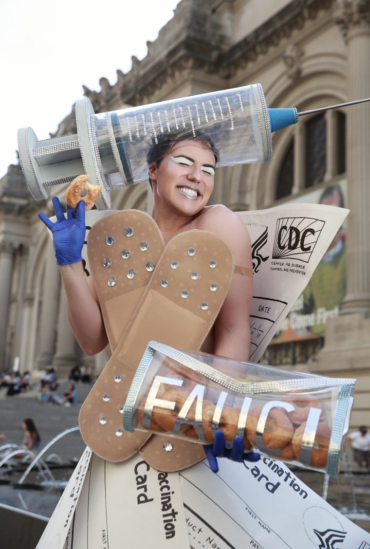 Bash packed a "Fauci" purse full of Krispy Kreme donuts in reference to the brand's promotion, which offers vaccinated guests one free donut every day in 2021. 