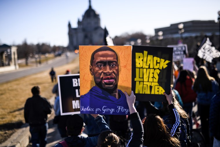 People march near the Minnesota State Capitol to honor George Floyd on March 19, 2021 in St Paul, Minn.