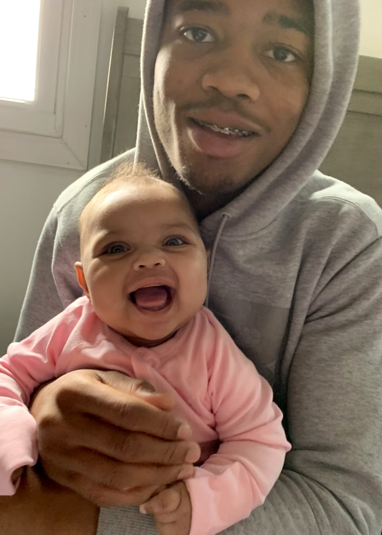 Image: Raheem Nixon, 19, and his 8 month old daughter Alayah. He has been banished to virtual instruction at his high school near Reading, Pa.