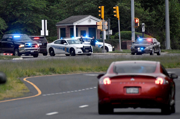 Image: Police cars are seen outside the CIA headquarters's gate after an attempted intrusion earlier in the day in Langley, Va., on May 3, 2021.