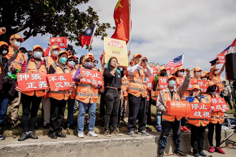 Protesters call for an end to violence against Asians at a rally hosted by Asians With Attitudes on April 3, 2021, in Oakland, Calif.