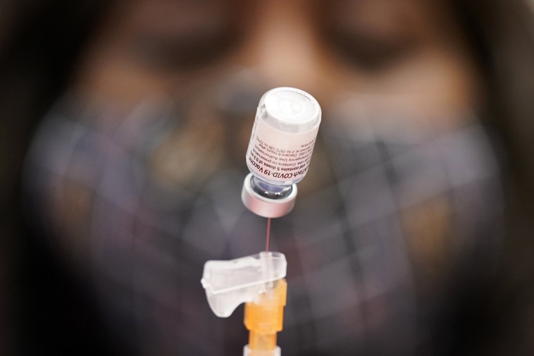 Image: A certified medical assistant prepares a dose of the Pfizer-BioNTech COVID-19 vaccine at a vaccination center in Las Vegas on Jan. 22, 2021.