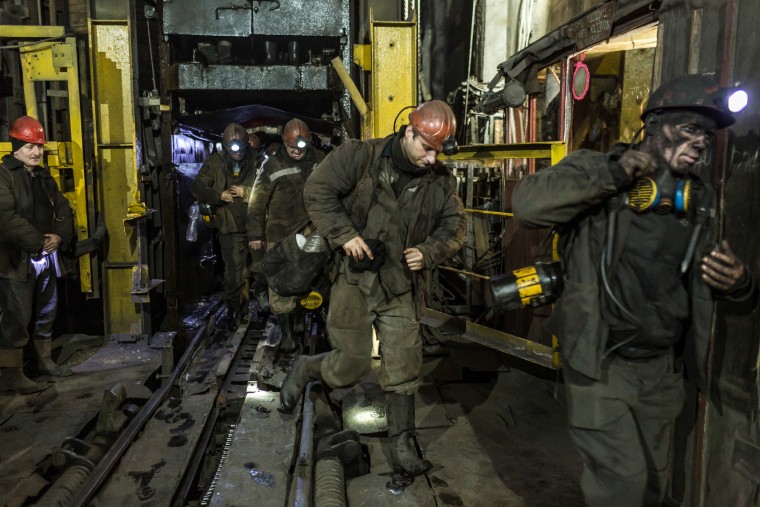 Image: Miners leave the elevator from their shift underground at the Tsentralna coal mine in Toretsk, Donetsk region, Ukraine