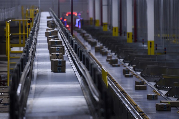 Image: Orders move down a conveyor belt at an Amazon fulfillment center in Staten Island, N.Y.