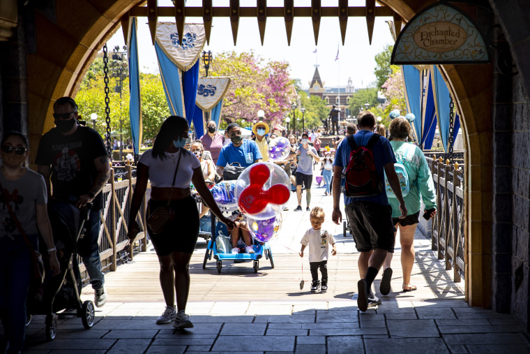 Image: Visitors pass through Sleepy Beauty Castle at Disneyland in Anaheim, Calif., on May 3, 2021.