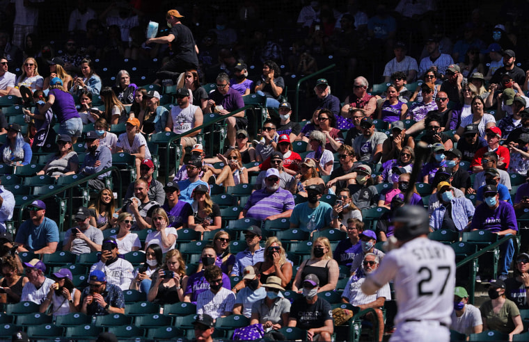 Image: Fans during the fourth inning of a game between the Colorado Rockies and Philadelphia Phillies at Coors Field in  Denver on April 25, 2021.