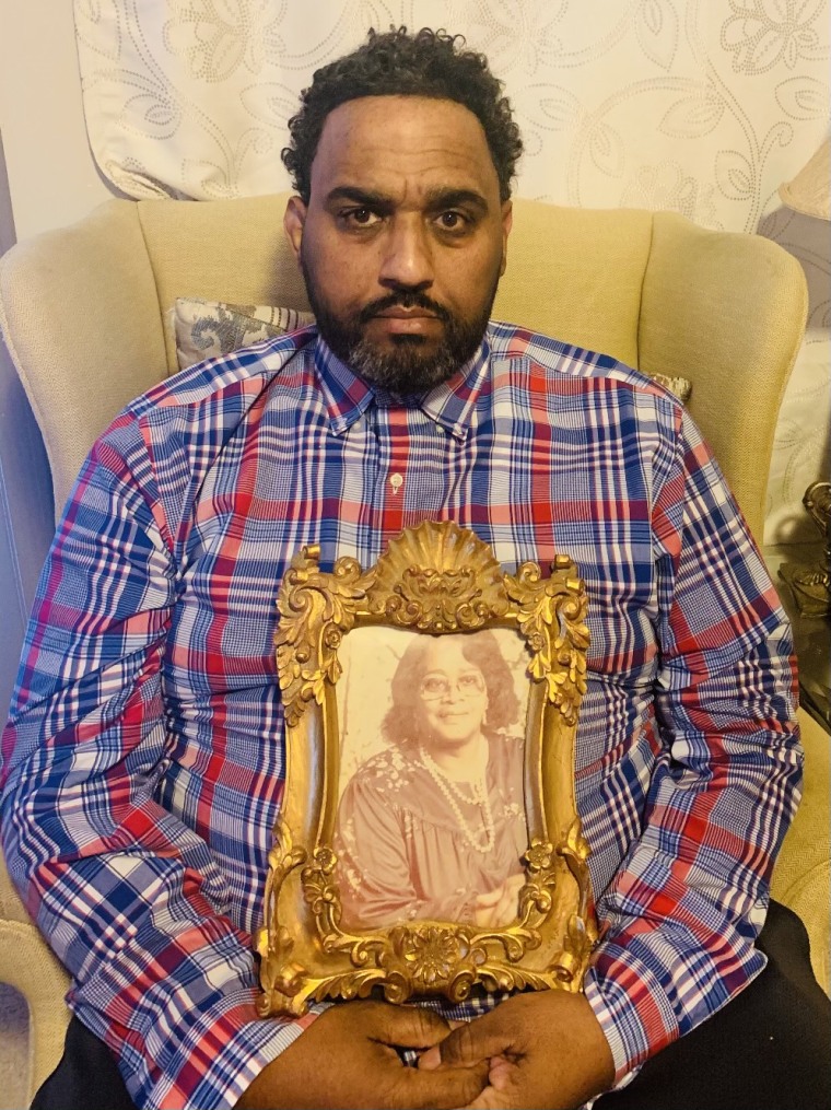 Christopher Pendergrass holds a photo of his beloved grandmother, Viola.