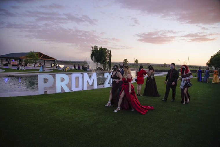Young people attend prom at the Grace Gardens Event Center in El Paso, Texas on Friday, May 7, 2021. Around 2,000 attended the outdoor event at the private venue after local school districts announced they would not host proms this year.