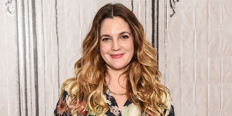 Image of Actress Drew Barrymore wearing a floral dress