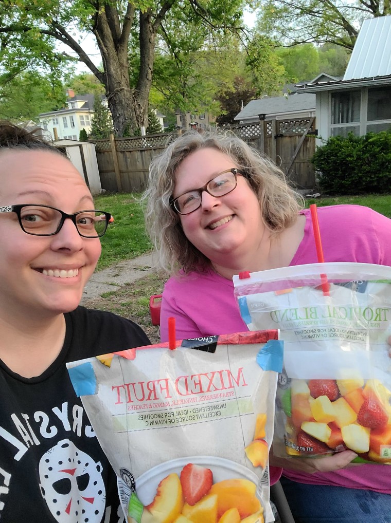 Mandy Allen and her sister, Melissa Mills, enjoying their backyard cookout drinks.