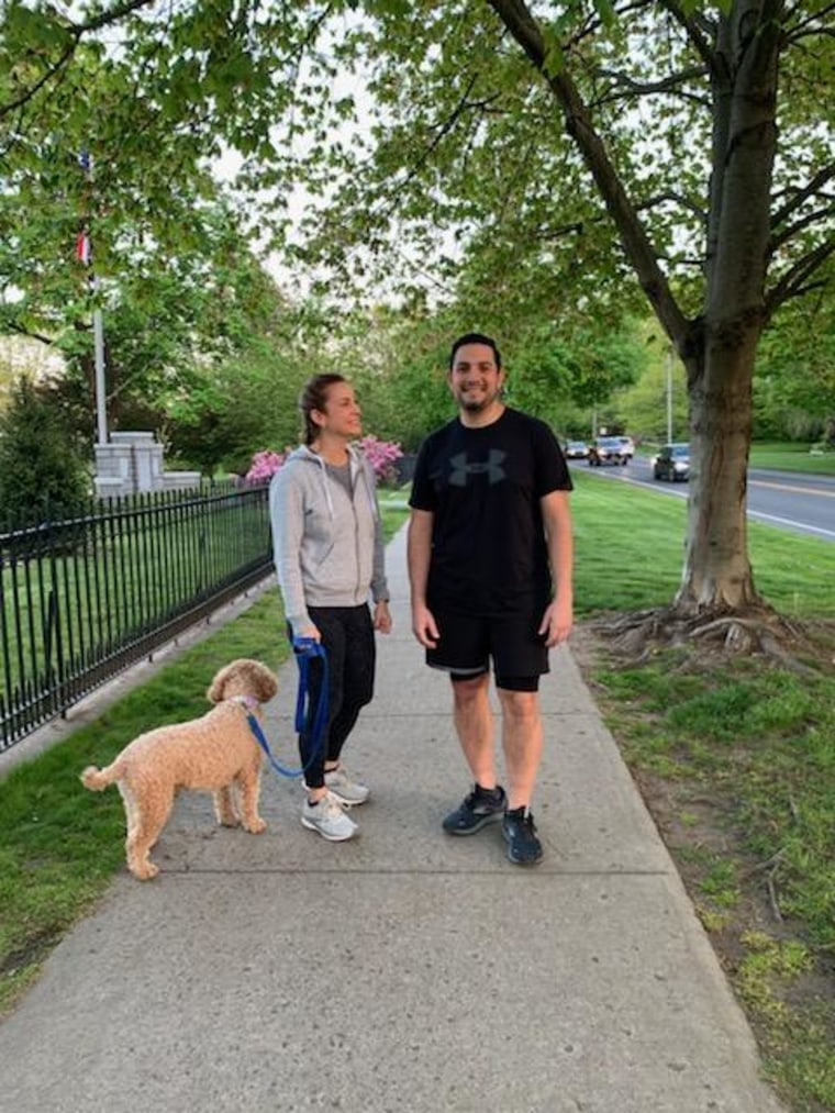 Konstantine Karloutsos and his wife, Erin, walking their dog near their home in Ridgefield, CT.