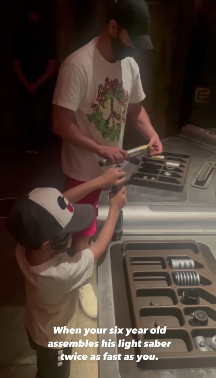 Justin Timberlake assembles a light saber with his six year old son, Silas.