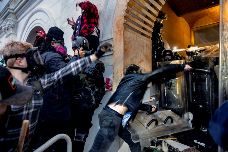 Trump supporters clash with police and security forces as people try to storm the Capitol on Jan. 6, 2021.