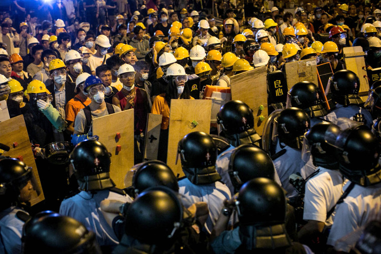 Image: Police clash with protesters in Hong Kong in 2014.