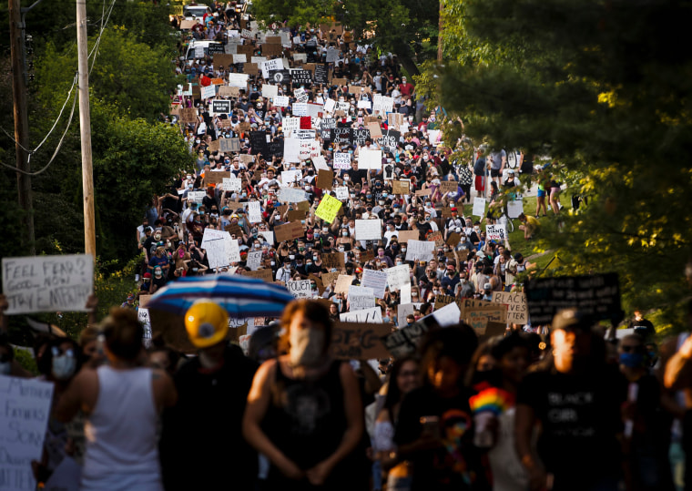 Image: Protesters walk to Des Moines Mayor Frank Cownie's house on June 3.