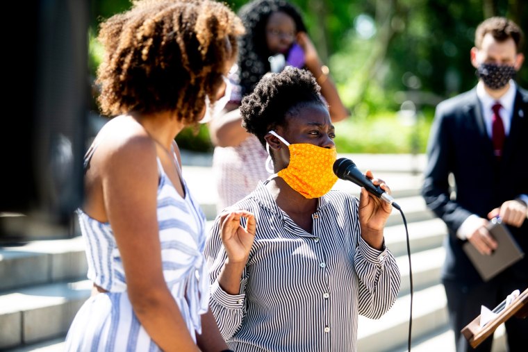 Image: Yena Ana Balekyani speaks to reporters outside the Iowa State Capitol in Des Moines, Iowa, on June 4, 2020.