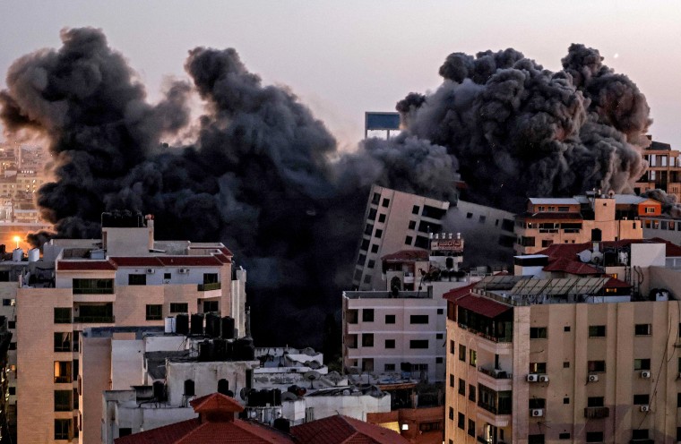 Image: Smoke billows from an Israeli air strike on the Hanadi compound in Gaza City, controlled by the Palestinian Hamas movement, on May 11, 2021.