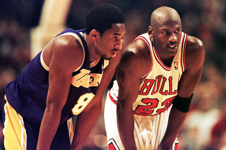 Los Angeles Lakers guard Kobe Bryant and Chicago Bulls guard Michael Jordan talk during a free-throw attempt during the fourth quarter of a game at the United Center in Chicago on Dec. 17, 1997.