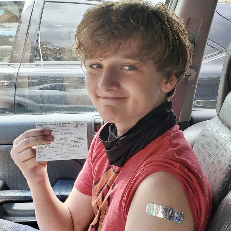 Image: Zachary, 15, got his first dose of the Pfizer vaccine in Athens, Ga., on Tuesday.
