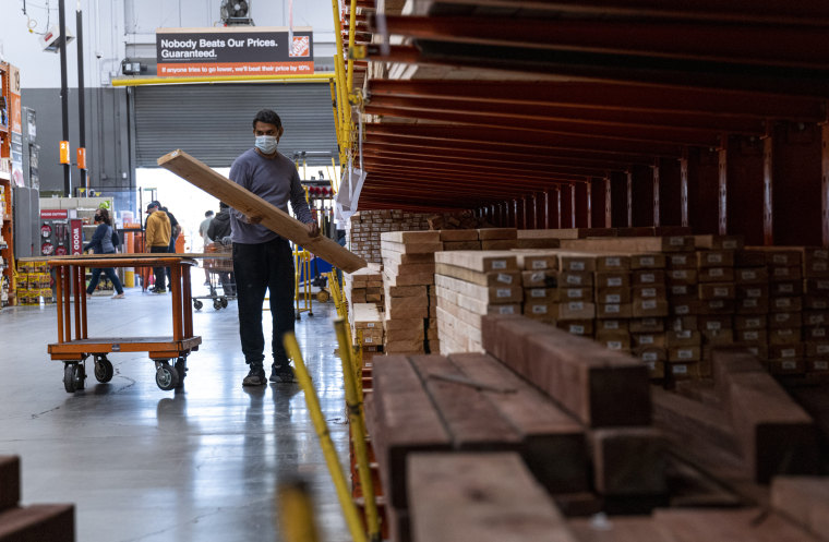 Image: A customer loads lumber at Home Depot