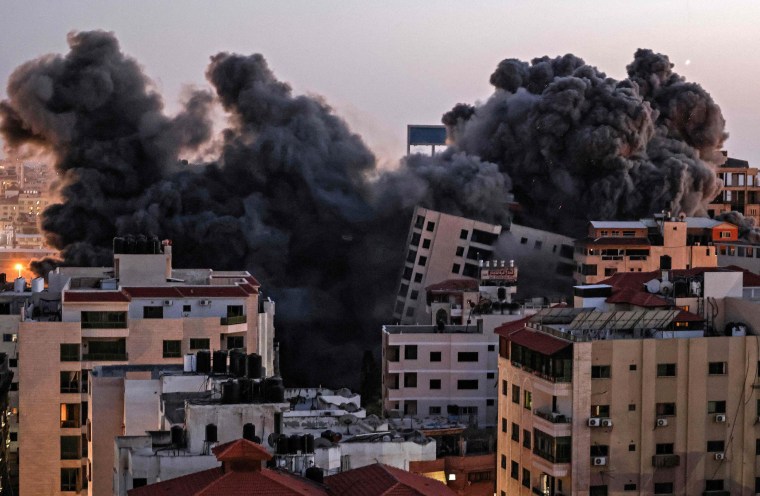 Smoke billows from an Israeli air strike on the Hanadi compound in Gaza City, controlled by the Palestinian Hamas movement, on May 11.