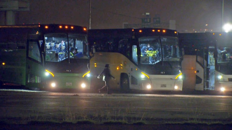 Passenger buses parked outside Kay Bailey Hutchison Convention Center Dallas. According to family of one of the passengers inside, the buses were full of migrant children who had been waiting on board several days to be transferred from Health and Human Services (HHS) custody to sponsors and family members.