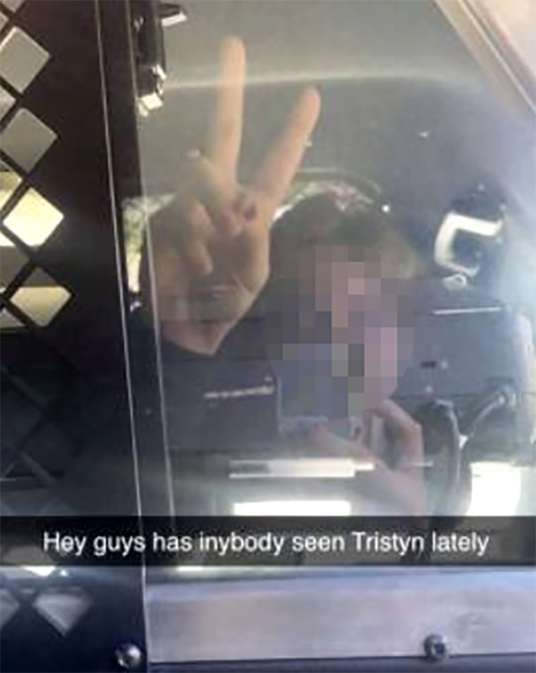 Image: Suspect Snapchats while sitting in a police vehicle. He is currently in custody in the killing of 13-year-old Tristyn Bailey in Florida.