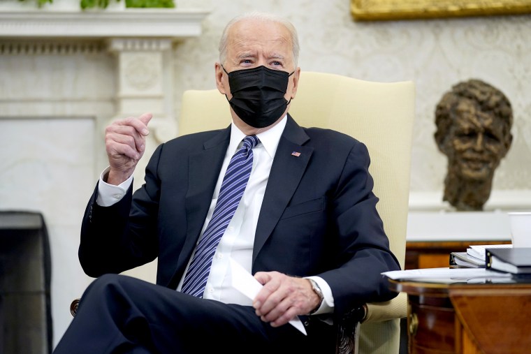 Image: President Joe Biden snaps his fingers as he responds to a reporters question during a meeting with congressional leaders in the Oval Office of the White House on May 12, 2021.