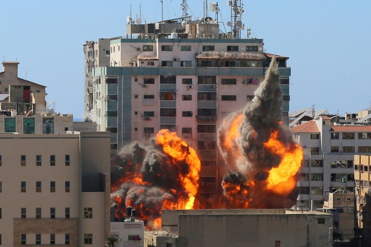 Image: A tower housing AP, Al-Jazeera offices collapses after Israeli missile strikes