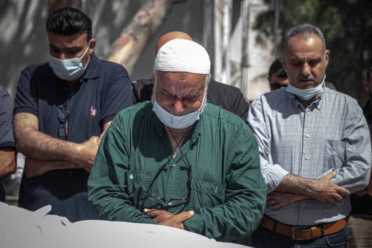 Palestinians perform funeral prayers for a member of the al-Kulak family, who was killed during an Israeli raid on Gaza City, on May 16, 2021.