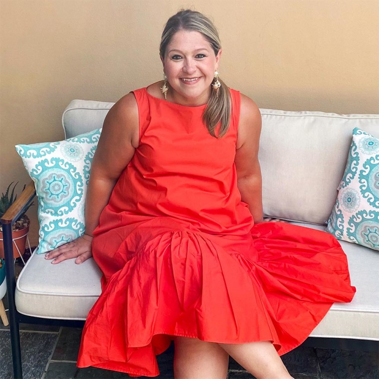 Terri Peters wearing an orange designer dress from the Summer 2021 Target collection