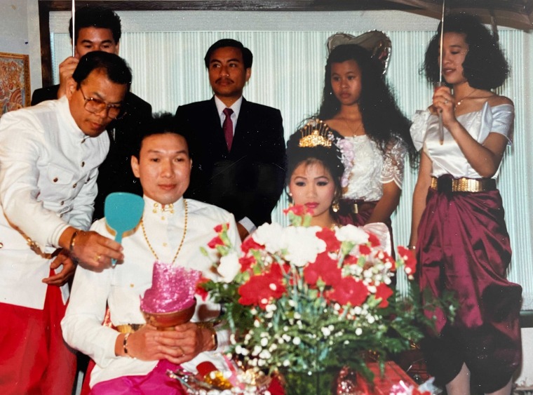 Alicia Tan's parents married on June 20, 1992. One part of a traditional Cambodian wedding includes a hair cutting ceremony during which family and friends pretend to cut the bride and groom's hair and show them through a hand mirror to symbolize a new life.
