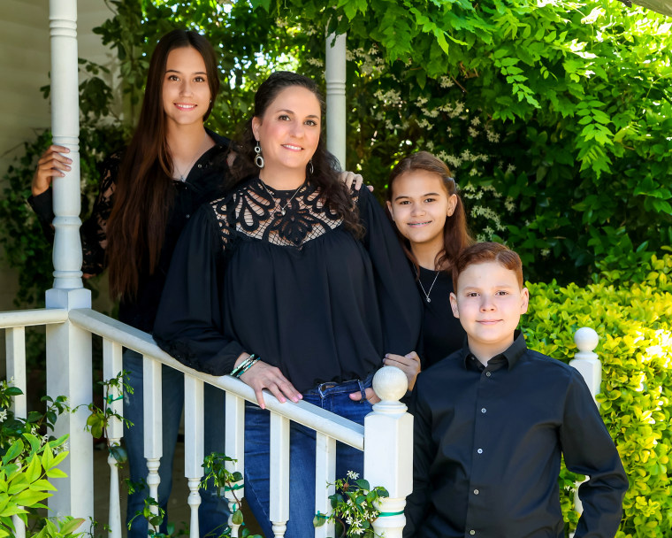 Tiffany Goodwin stands with her children, Elizabeth, left, Katherine, second from right, and Jerry, right.