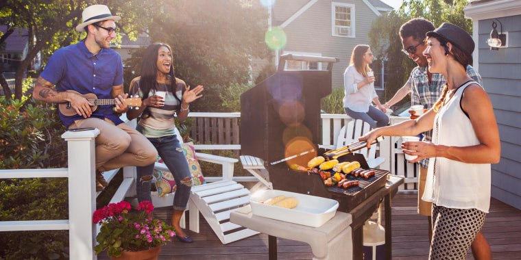 Friends enjoying barbecue on patio