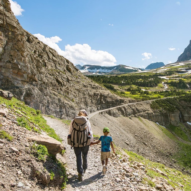 Mother and Son walking in Glacier National Park