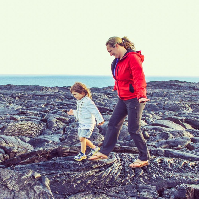 Mother and Son on volcano rocks at Hawaii National Park