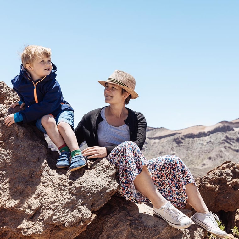 Mother and Son sitting on rock in Tenerife
