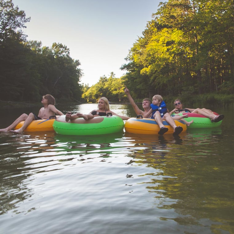 Family in tubes floating down Sleeping Bear Dunes National