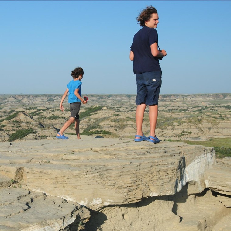 Father and Son looking out at the Theodore Roosevelt National Park