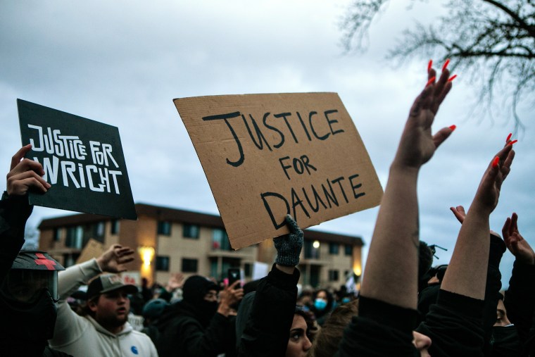 Image: Protesters gather outside the Brooklyn Center Police Department calling for justice for Daunte Wright