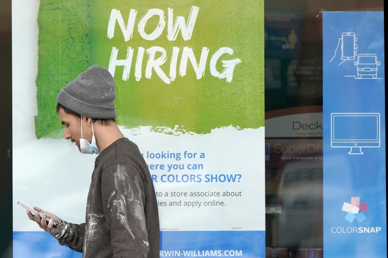 Image: A 'Now Hiring' sign at a Sherwin Williams store in Woodmere Village, Ohio