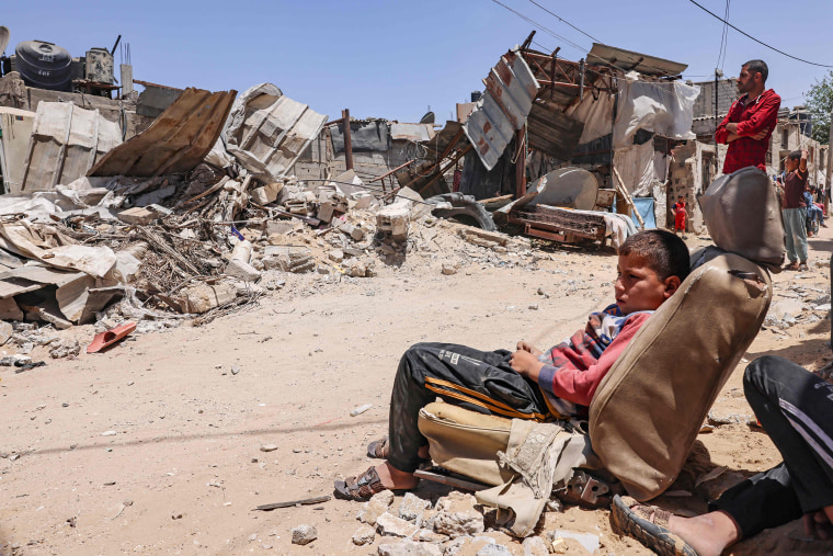 Image: Gaza residents inspect their house after it was destroyed by an Israeli airstrike in the southern Gaza Strip on Sunday.