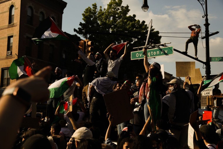 Pro-Palestinian protesters gather in Brooklyn, N.Y., on Saturday to mark Nakba Day, an annual commemoration of the displacement of hundreds of thousands of Palestinians from their homes in 1948, and to demand an end to Israeli airstrikes over the Gaza Str